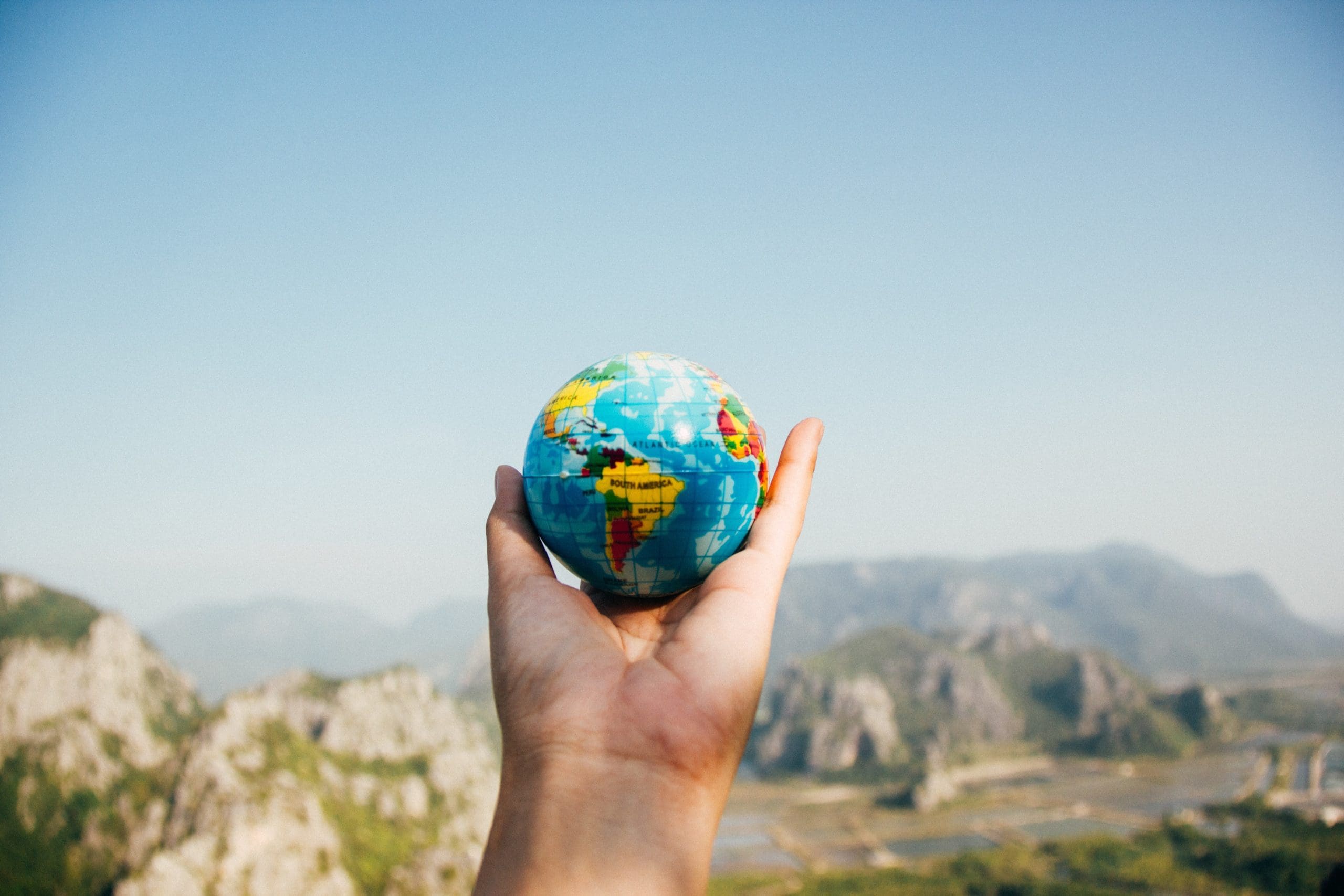 Stock picture of globe being held in a hand